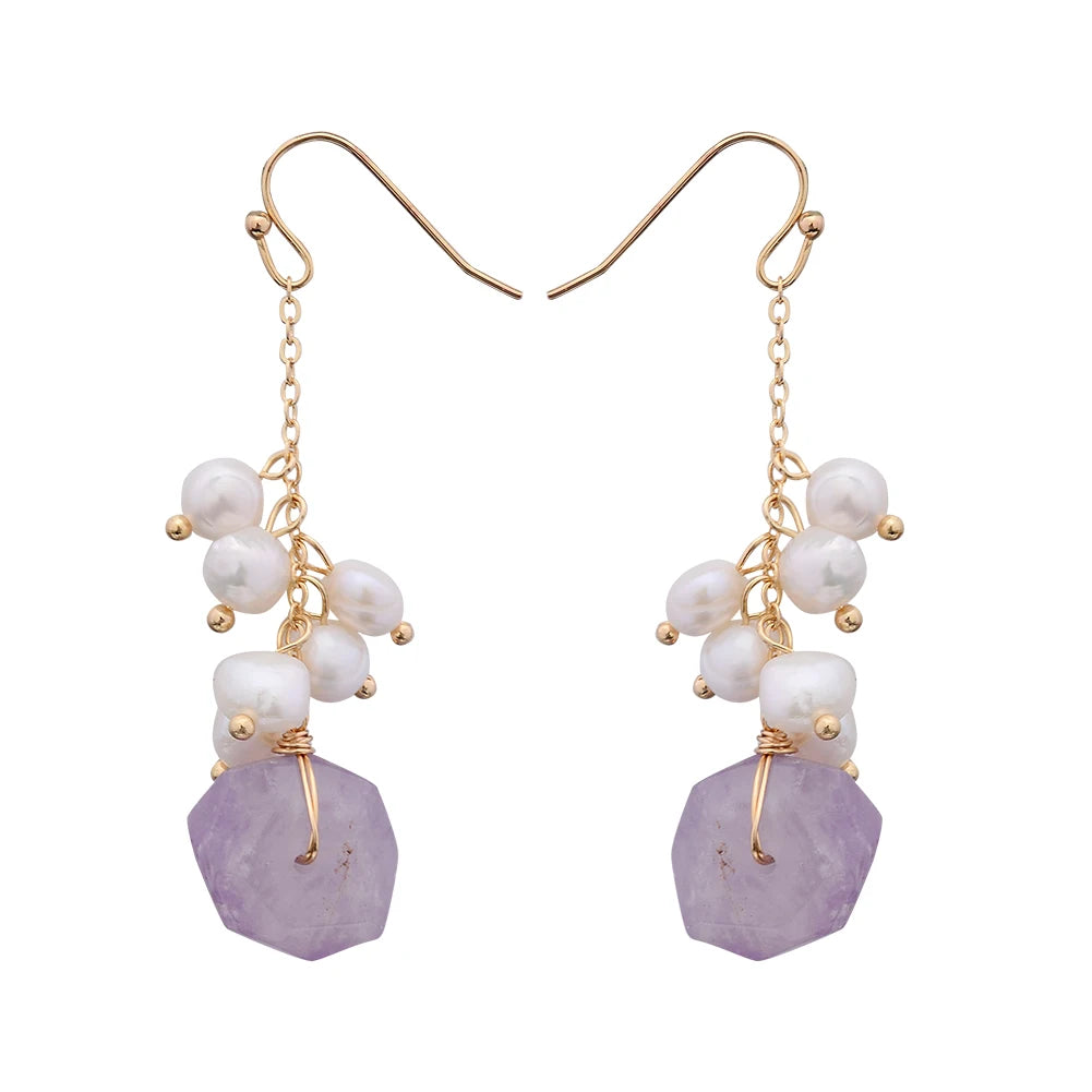 Isolated product image of Twilight Bloom Earrings featuring gold-filled hooks, amethyst stones, and freshwater pearls.