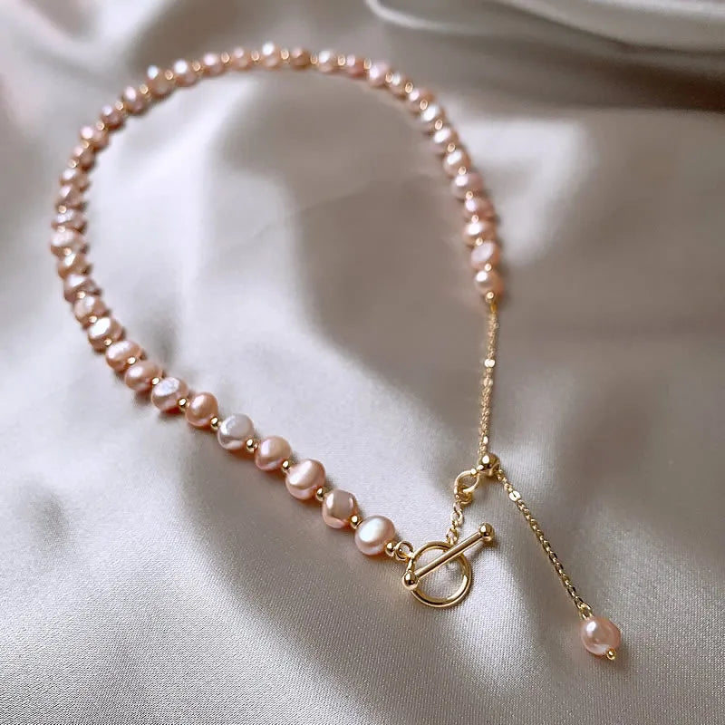 Pink Baroque Pearl Gold-Filled Necklace with 14K gold-filled toggle and chain, displayed on a neutral satin background.
