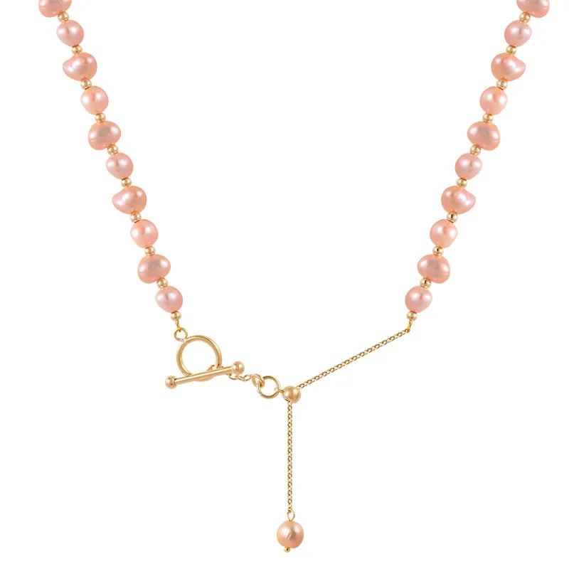 Product close-up of Pink Baroque Pearl Gold-Filled Necklace with natural freshwater pearls and gold chain drop accent.